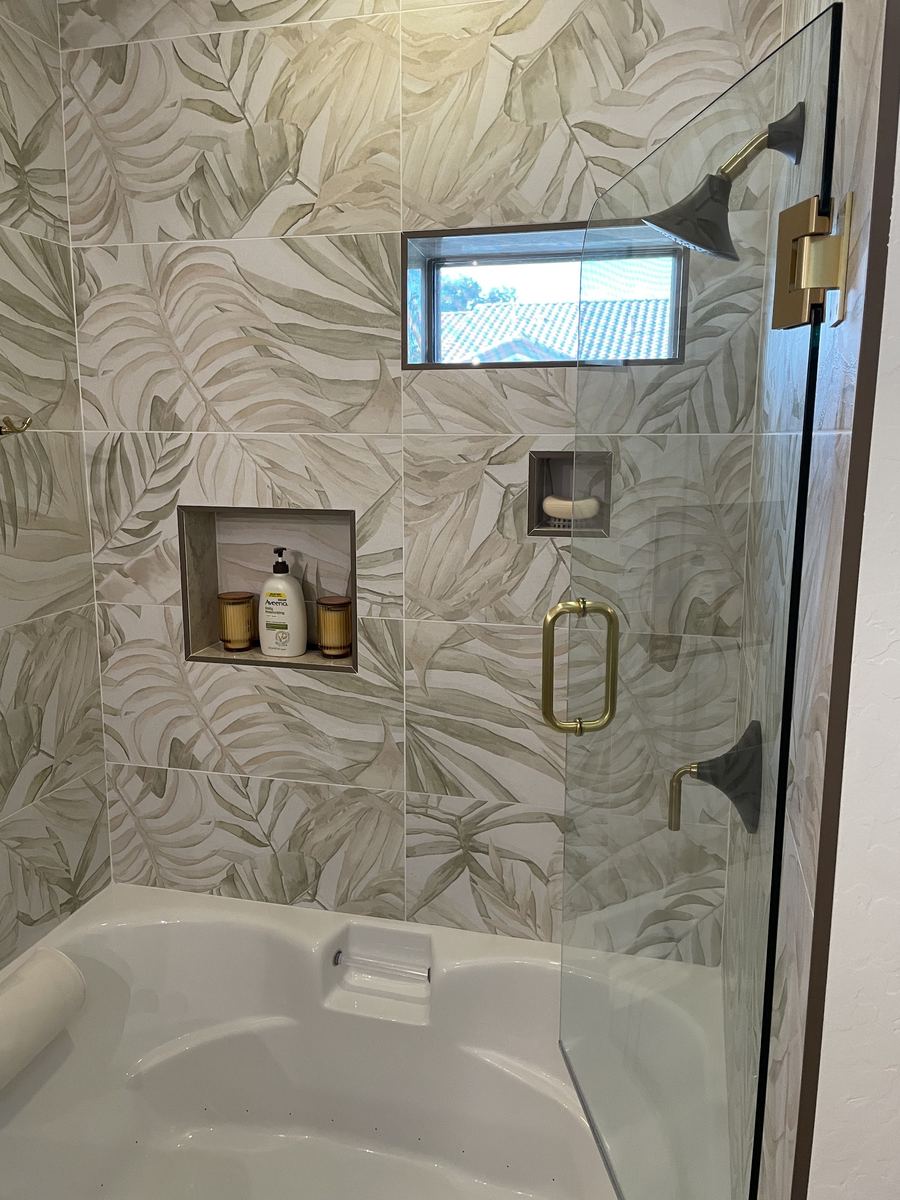 Botanical pattern tile shower with glass door