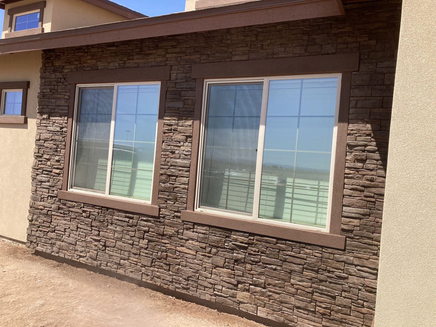 Stacked stone exterior wall by JCP Tile & Stone