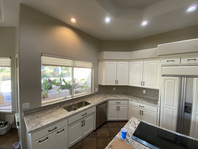White kitchen with tile backsplash
