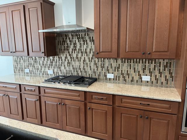 Glass and stone mosaic backsplash